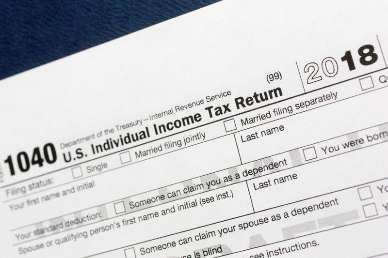 Most taxpayers got a tax cut last year, but when they file their returns they may find themselves with less of a refund check — or even owing the government money. (AP Photo/Mark Lennihan, File)