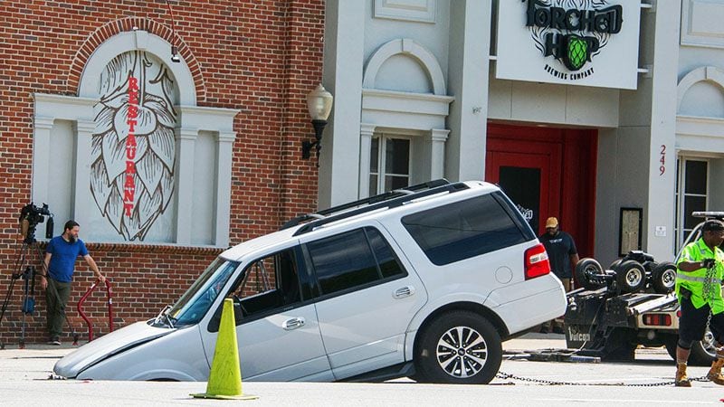 A white SUV fell into a sinkhole in Midtown Atlanta in June.