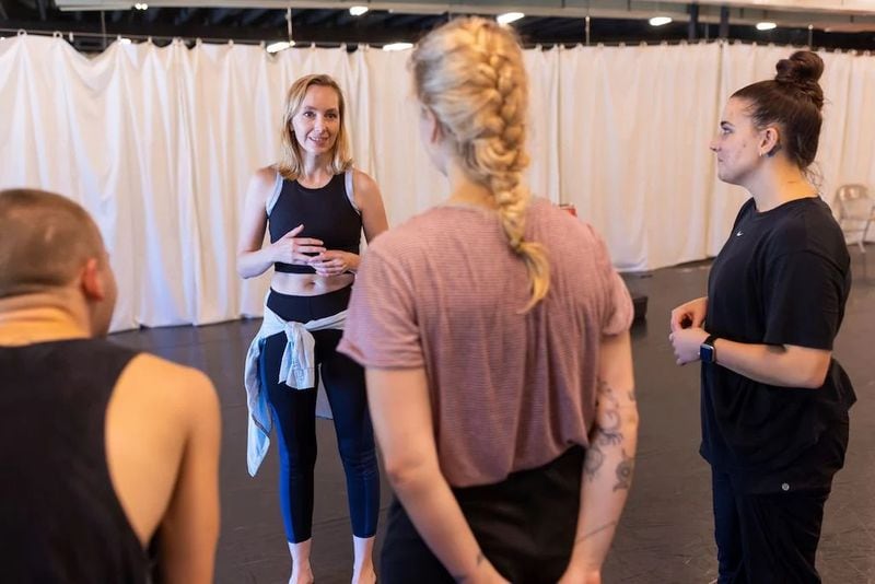 Nadya Zeitlin (second from left) talks with Bautanzt Here dancers during rehearsal. Photo: Terence Rushin