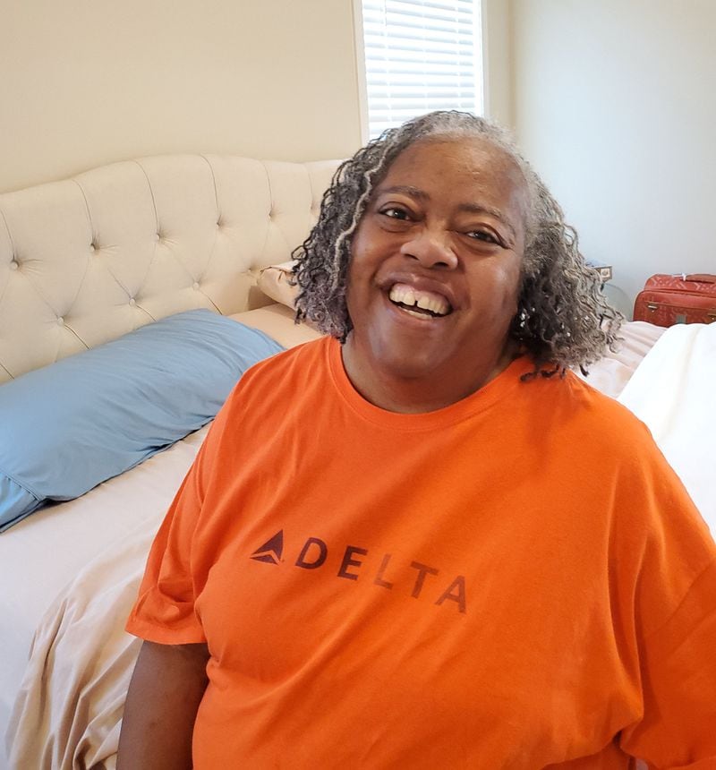 Janice Cockfield laughs at home in South Fulton while joking around with her sister Janese, who had just combed Janice's hair in preparation for going to physical therapy on September 1, 2020. Janice, a Delta Air Lines customer experience specialist, stunned her Emory University Hospital Midtown medical team by surviving COVID-19 after being hospitalized for 110 days, with more than two months spent in the ICU, most of that time on a ventilator. She returned home on July 17. (credit: Janese Cockfield / Contributed)