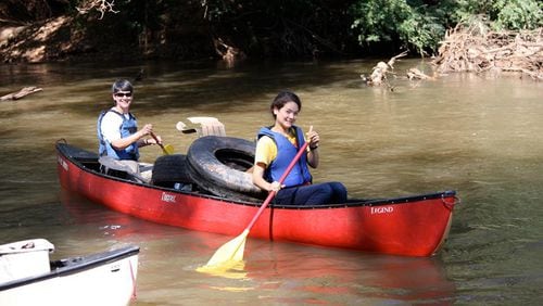 Volunteers at a past Rivers Alive clean-up return with a canoe filled with litter and debris. The annual Rivers Alive clean-up with Keep Roswell Beautiful and the city of Roswell is set for Saturday, Sept. 22 at Riverside Park on the Chattahoochee River. RIVERS ALIVE via Facebook
