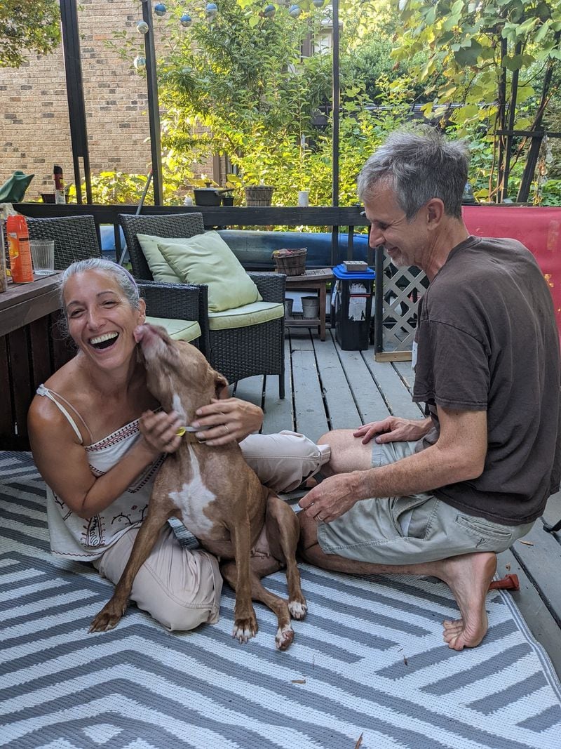 The AJC's Ligaya Figueras and husband Joe Gudiswitz have found adopting a dog to be the best therapy during rough times. Courtesy of Paula Pontes