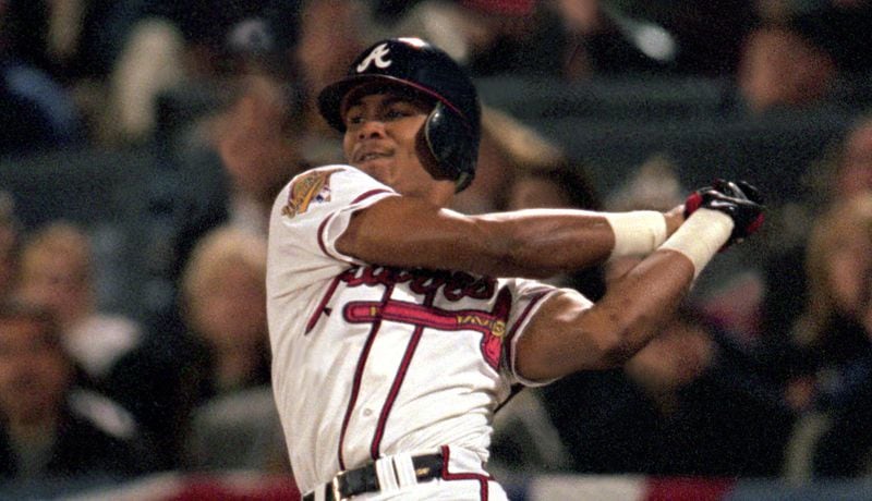 Acuna is already being compared to former Braves outfielder Andruw Jones (above), who broke into the majors at age 19.  (Photo by Stephen Dunn/Getty Images)