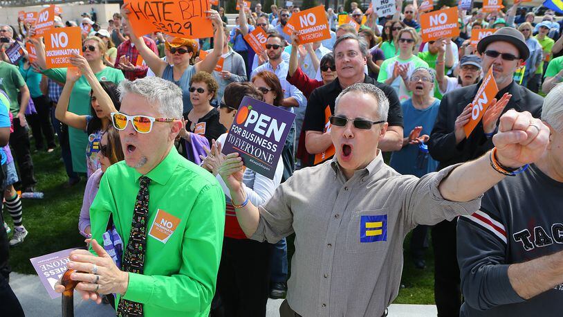 031715 ATLANTA: David Sicay-Perrow (left) and Robert Todd get vocal during a rally at the Capitol against SB 129, the "license to discriminate" legislation pushed by Sen. Josh McKoon and Rep. Sam Teasley on Tuesday, March 17, 2015, at Liberty Plaza in Atlanta. Curtis Compton / ccompton@ajc.com David Sicay-Perrow (left) and Robert Todd get vocal during a rally at the Capitol against S.B. 129, the "religious liberty" legislation pushed by state Sen. Josh McKoon last legislative session. Curtis Compton / ccompton@ajc.com
