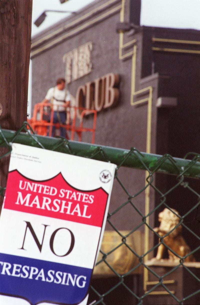 Beyond the U.S. Marshall warning, the sign from the side of the Gold Club is removed in 2001. (ANDY KJELLGREN/ Special)