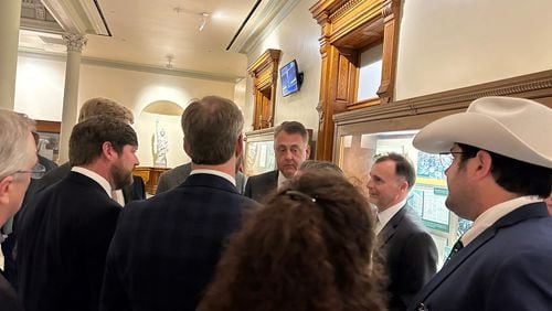 Senate Majority Leader Steve Gooch, R-Dahlonega, gets an earful from lobbyists Wednesday night. Gooch was one of the lawmakers who negotiated a compromise on House Bill 189, which would raise the maximum weight of trucks carrying some goods.