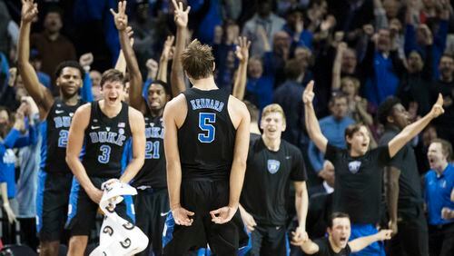 Duke guard Luke Kennard (5) celebrates with his teammates after tying the game during the final minutes against Louisville in the ACC tournament, Thursday, March 9, 2017, in New York. Duke won 81-77. (AP Photo/Mary Altaffer)