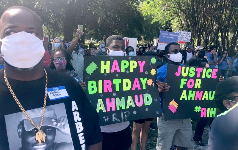 Some attending last year's rally carried birthday signs for Ahmaud Arbery, who would have turned 26. Additional demonstrations are planned in Brunswick ahead of next week's trial.