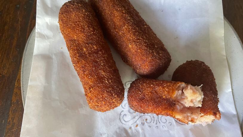 The ham croquetas at Buena Gente have dry-cured ham ground in the filling, which provides sweet, mild and salty notes. Angela Hansberger for The Atlanta Journal-Constitution