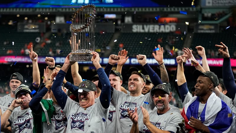 Braves manager Brian Snitker holds the trophy after winning the World Series in Game 6 against the Houston Astros on Nov. 2 in Houston. The Braves won 7-0. (AP Photo/David J. Phillip)