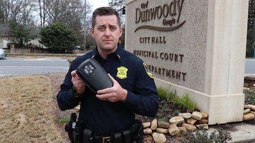 Dunwoody police Lt. Patrick Krieg shows a license plate-reading device.