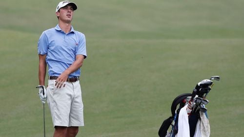 Ashton Poole, last year's winner, reacts as he hits his fairway shot into the creek on No. 12 and had to take a drop.  Wednesday was the first day of play in the Dogwood Invitational at the Druid Hills Golf Club.  Bob Andres / bandres@ajc.com