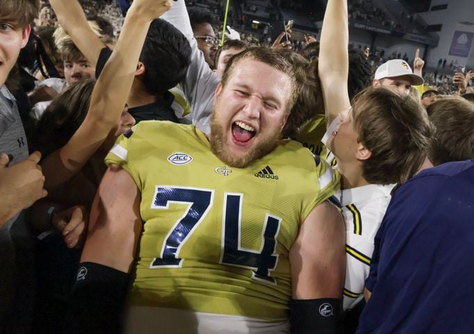 Georgia Tech Yellow Jackets offensive lineman Tyler Gibson (74) and other players celebrate their win over North Carolina.  (Bob Andres for the Atlanta Journal Constitution)