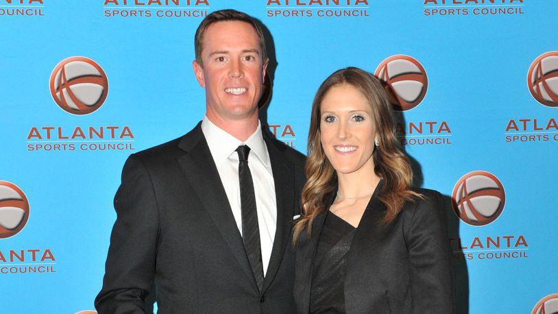 Matt Ryan, quarterback for the Atlanta Falcons, with his wife Sarah pose for photographers after he accepted the Professional Athlete of the Year presented by SunTrust Sports and Entertainment during the The 8th annual Atlanta Sports Awards at the Fox Theater in Atlanta on Tuesday, March 5, 2013. HYOSUB SHIN / HSHIN@AJC.COM