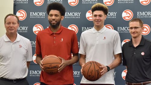 DeAndre’ Bembry (center left) and Isaia Cordinier (center right) pose with head coach Mike Budenholzer (left) and then assistant general manager Wes Wilcox during a press conference on Tuesday, June 28, 2016. The Hawks selected St. Joseph’s University forward DeAndre’ Bembry with the 21th overall pick in the first round and Isaia Cordinier in the second round (44th overall) of the 2016 NBA Draft. HYOSUB SHIN / HSHIN@AJC.COM