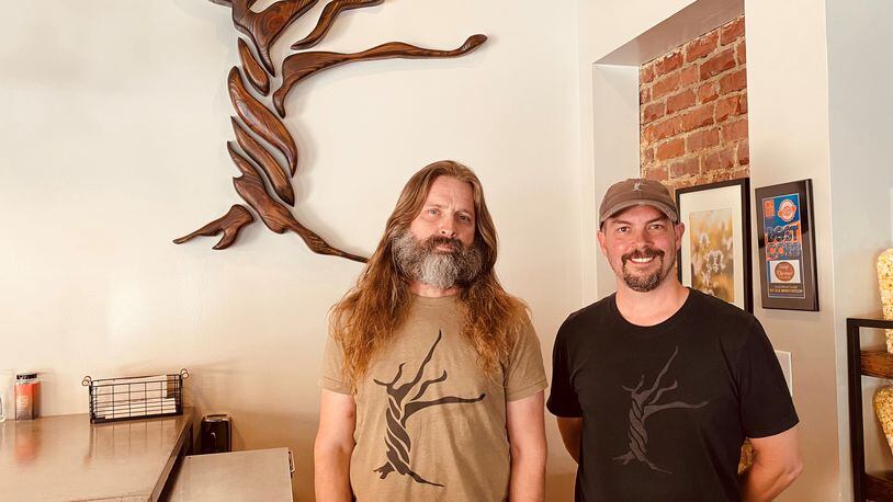 Mark Henson (left) and Doug Farrell opened Skint Chestnut Brewing on Broad Street in Powder Springs last July. (Bob Townsend for The Atlanta Journal-Constitution)