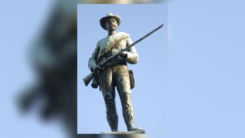 Old Joe stands in the center of the downtown square of Gainesville, Ga.  Called Old Joe by locals, the soldier wears a belt buckle emblazoned with the initials "CSA" for Confederate States of America and boasts a plaque declaring he is dedicated to "Southern Convictions."  (AP Photo/The Times, Paula Stuhr)