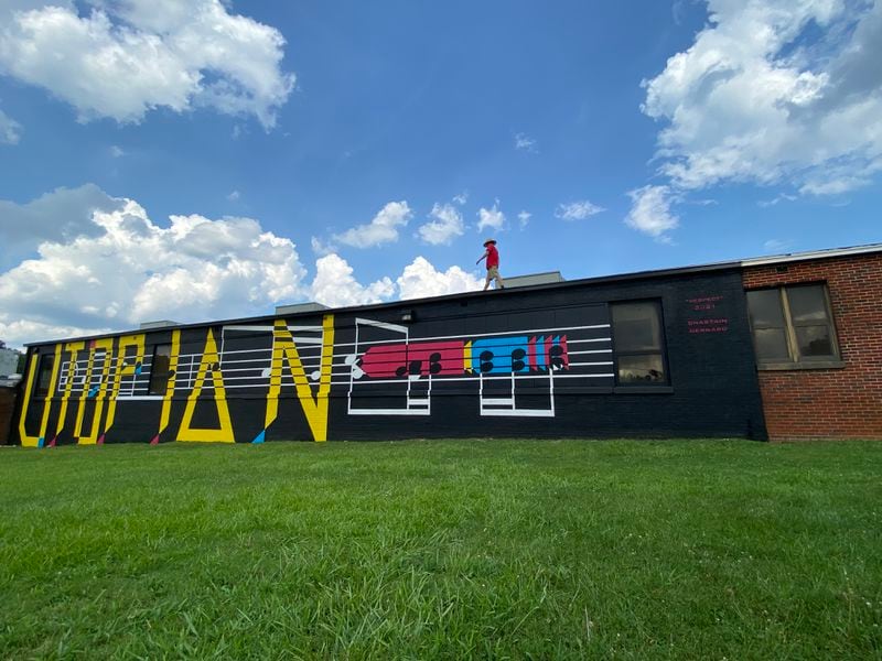 Atlanta-based artist Chastain Bernard Clark created a mural for Utopian Academy of the Arts in Ellenwood based on the song "Respect" as written by Otis Redding. (Courtesy of Chastain Bernard Clark)