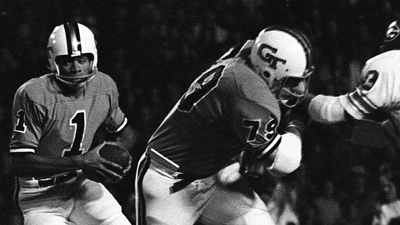 Georgia Tech quarterback Eddie McAshan follows a blocker against Georgia in 1971. (AJC)