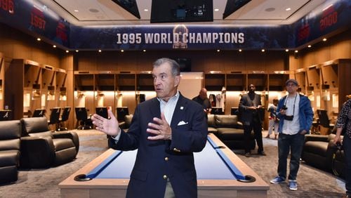 John Schuerholz,  the Braves’ general manager from October 1990 through the 2007 season, visits the home clubhouse at  SunTrust Park (now Truist Park) in 2017.  The Braves’ 1995 World Series championship is prominently commemorated in the clubhouse.