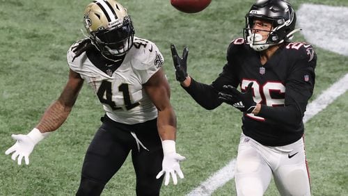 Atlanta Falcons cornerback Isaiah Oliver breaks up a pass to Saints running back Alvin Kamara but can’t come down with the interception during the fourth quarter Sunday, Dec. 6, 2020, at Mercedes-Benz Stadium in Atlanta.  (Curtis Compton / Curtis.Compton@ajc.com)