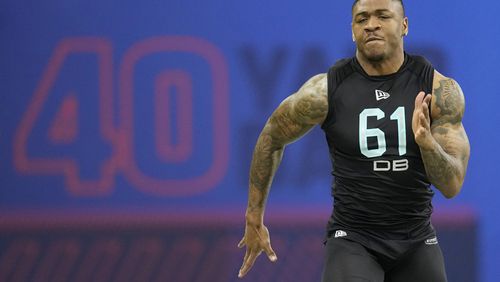 Former Georgia Tech defensive back Juanyeh Thomas runs the 40-yard dash at the NFL scouting combine Sunday in Indianapolis. (AP Photo/Charlie Neibergall)