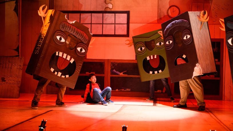 In one of the most engaging song and dance numbers in the Alliance Theatre's world-premiere musical adaptation of Oliver Jeffers' celebrated children's book "The Incredible Book Eating Boy," the books decide to fight back. (Photos by Greg Mooney.)