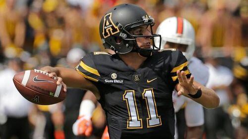 FILE - In this Sept. 17, 2016, file photo, Appalachian State's Taylor Lamb (11) looks to pass against Miami during the first half of an NCAA college football game, in Boone, N.C.  (AP Photo/Chuck Burton, File)