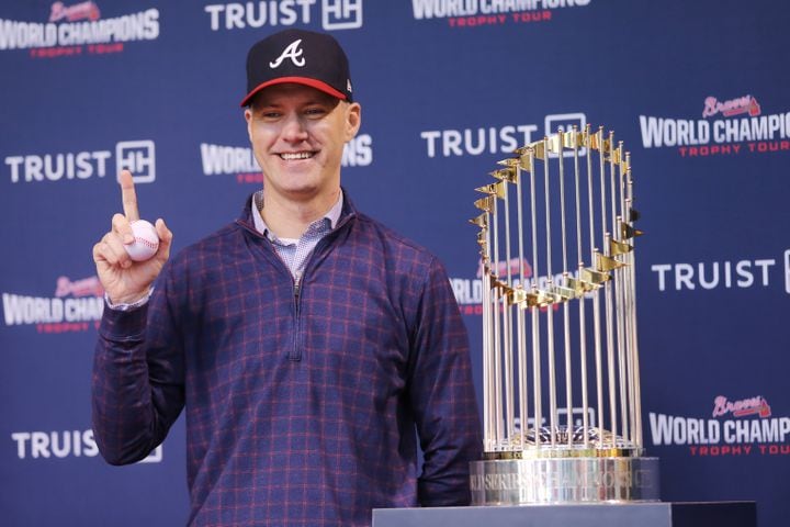 Robert Warner reacts with a baseball in his hand while he gets his picture taken during the first stop of the World Champions Trophy Tour at Colony Square in Midtown on Tuesday, February 15, 2022. Miguel Martinez for The Atlanta Journal-Constitution 