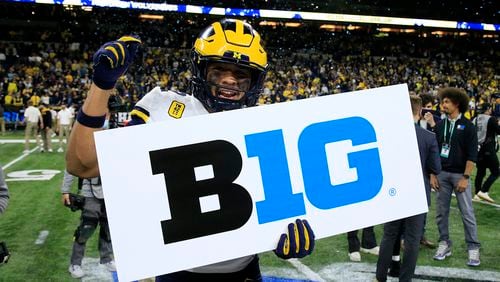 TJ Guy #42 of the Michigan Wolverines celebrates winning the Big Ten Football Championship game against the Iowa Hawkeyes at Lucas Oil Stadium on Dec. 4, 2021, in Indianapolis, Indiana. (Justin Casterline/Getty Images/TNS)