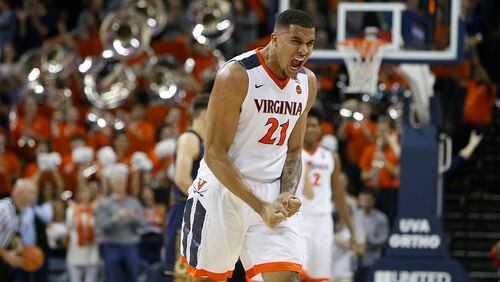 Virginia forward Isaiah Wilkins (21) celebrates his team's 62-57 win at the end of an NCAA college basketball game in Charlottesville, Va., Saturday, March 3, 2018. Virginia won the game 62-57. (AP Photo/Steve Helber)