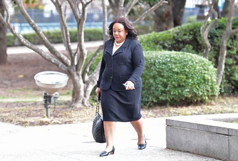 Former DeKalb Commissioner Sharon Barnes Sutton walks toward DeKalb County Courthouse for a hearing by Judge Asha Jackson in February 2017. Sutton has filed a lawsuit alleging that the DeKalb Board of Ethics is unconstitutional because some of its members are appointed by community organizations instead of by elected officials. (HYOSUB SHIN / HSHIN@AJC.COM)