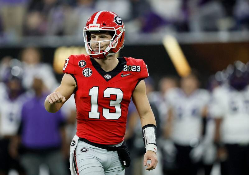 Georgia Bulldogs quarterback Stetson Bennett (13) reacts to a touchdown against the TCU Horned Frogs during the first half of the College Football Playoff National Championship at SoFi Stadium in Los Angeles on Monday, January 9, 2023. (Jason Getz / Jason.Getz@ajc.com)