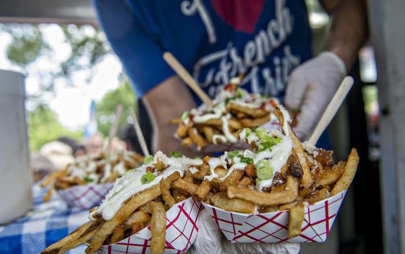 French fries ready to be served up at The Fry Guy food truck during the Atlanta Street Food Festival at Piedmont Park in Atlanta on Saturday, July 11, 2015.
