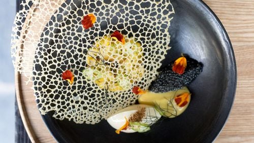 Why is Bacchanalia a first thought for fine dining in Atlanta? A first course of Sweet Local Corn includes a delicate lace tuile covering the corn pudding and spoonful of paddlefish caviar. CONTRIBUTED BY HENRI HOLLIS