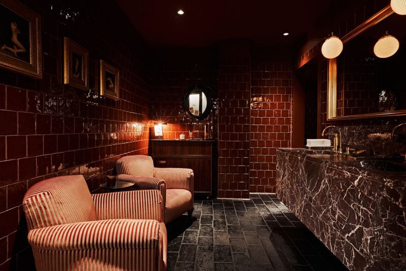 The dark, moody bathroom at the newly opened Little Sparrow on Atlanta's Westside is a typically vibey space that encourages lingering and an immersion in style.
(Courtesy of Little Sparrow)