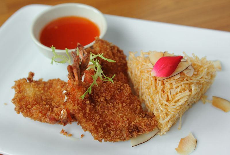 Butterfly Coconut Shrimp served with crispy rice noodles and sweet chili sauce. (BECKY STEIN PHOTOGRAPHY)