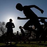 Kids with the Walton Youth Running Club work out in Marietta on Thursday, March 28, 2024.   (Ben Gray / Ben@BenGray.com)