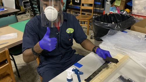 Kelvin Smith, a volunteer with Atlanta Beats Covid, works in the Decatur Makers makerspace to produce face shields that will be donated to Atlanta area healthcare workers. Contributed
