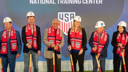 Governor Brian Kemp (R) of Georgia, JT Barlow, Arthur M. Blank, Cindy Parlow Cone, and other members of local and state governments get ready to break ground during the ground breaking of the Arthur M. Blank U.S. Soccer National Training Center on Monday, April 8, 2024, in Atlanta, at State Farm Arena. (Atlanta Journal-Constitution/Jason Allen)