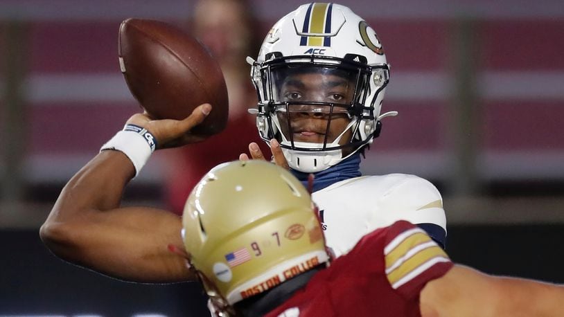 Georgia Tech quarterback Jeff Sims passes under pressure from Boston College defensive end Marcus Valdez (97) during the first half Saturday, Oct. 24, 2020, in Boston. (Michael Dwyer/AP)