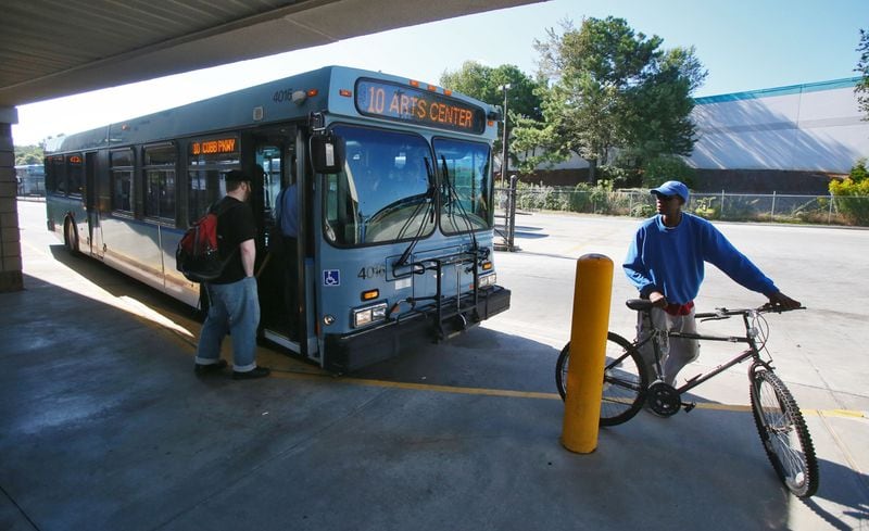 Sep. 23, 2013 - Passengers board Cobb County Transit Bus # 10 at the Marietta transfer center. BOB ANDRES / BANDRES@AJC.COM