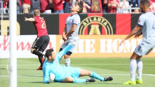 Atlanta United and Chicago players react to the first goal scored by Atlanta United in Saturday’s MLS game at Georgia Tech’s Bobby Dodd Stadium. (Miguel Martinez / Mundo Hispanico)