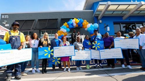 As part of supporting the communities in Vine City, organizations obtain grants from Walmart during the reopening a former Walmart Superstore location as a Neighborhood Market on Wednesday, May 22, 2024. (Miguel Martinez / AJC)