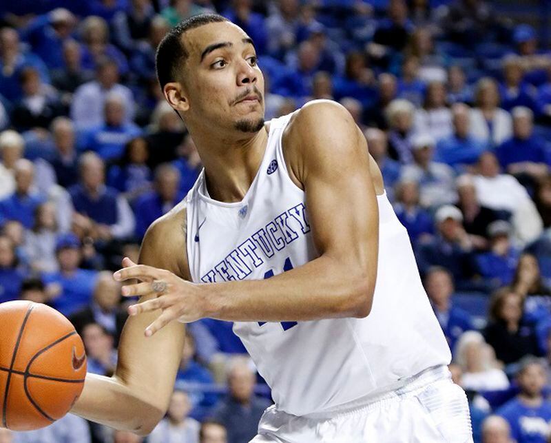 Kentucky's Trey Lyles saves a ball from going out of bounds during the second half of an NCAA college basketball game against Arkansas, Saturday, Feb. 28, 2015, in Lexington, Ky. Kentucky won 84-67. (AP Photo/James Crisp) Kentucky's starting small forward is Trey Lyles. He's 6-foot-10. (James Crisp/AP photo)
