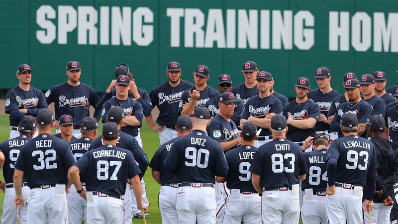 Braves manager Brian Snitker gathers his players on the field for the first full squad workout at spring training Saturday Feb. 18, 2017, in Champion Stadium at the ESPN Wide World of Sports in Lake Buena Vista, Fla.
