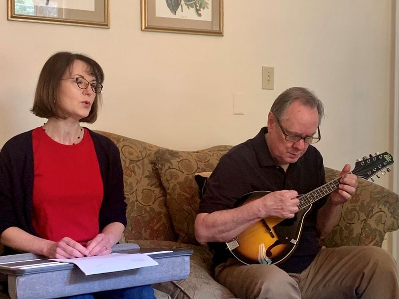 Lee Nowell and Philip DePoy rehearse “The Rumpled Man,” a short-story reading, accompanied by music, that will launch the six-part “Written in Water” series at Decatur Library on June 15. Howard Pousner/For the AJC