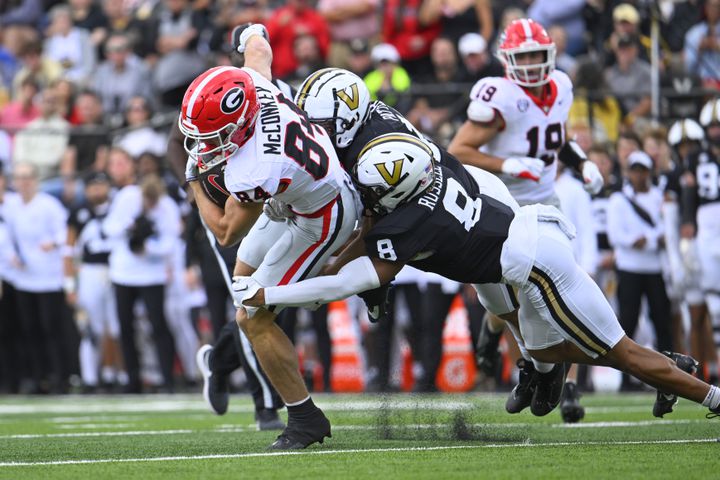 Georgia wide receiver Ladd McConkey (84) runs against Vanderbilt cornerback Tyson Russell (8) and linebacker Langston Patterson (10) during the first half of an NCAA football game, Saturday, Oct. 14, 2023, in Nashville, Tenn. (Special to the AJC/John Amis)