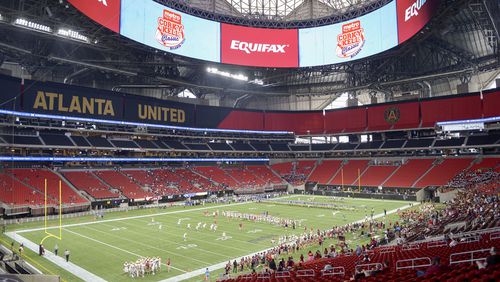 Brookwood and McEachern football teams warm up before the start of their game in the Corky Kell Classic Saturday, Aug. 24, 2019.,  at the Mercedes Benz Stadium in Atlanta .