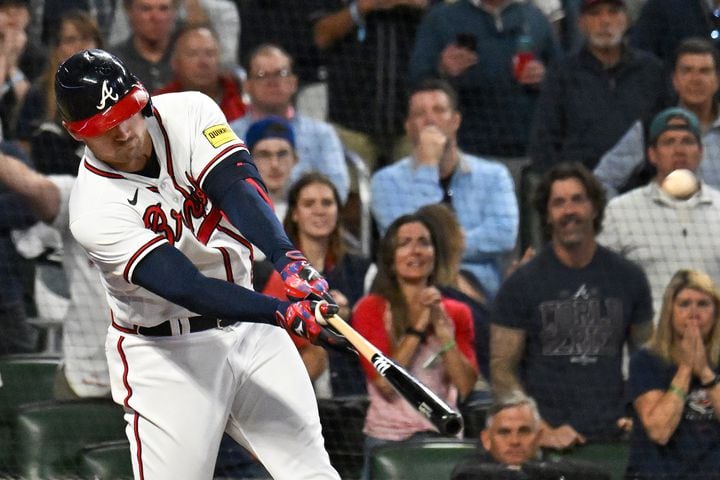 Atlanta Braves’ Austin Riley (27) hits a two-run home run against the Philadelphia Phillies during the eighth inning of NLDS Game 2 in Atlanta on Monday, Oct. 9, 2023.   (Hyosub Shin / Hyosub.Shin@ajc.com)